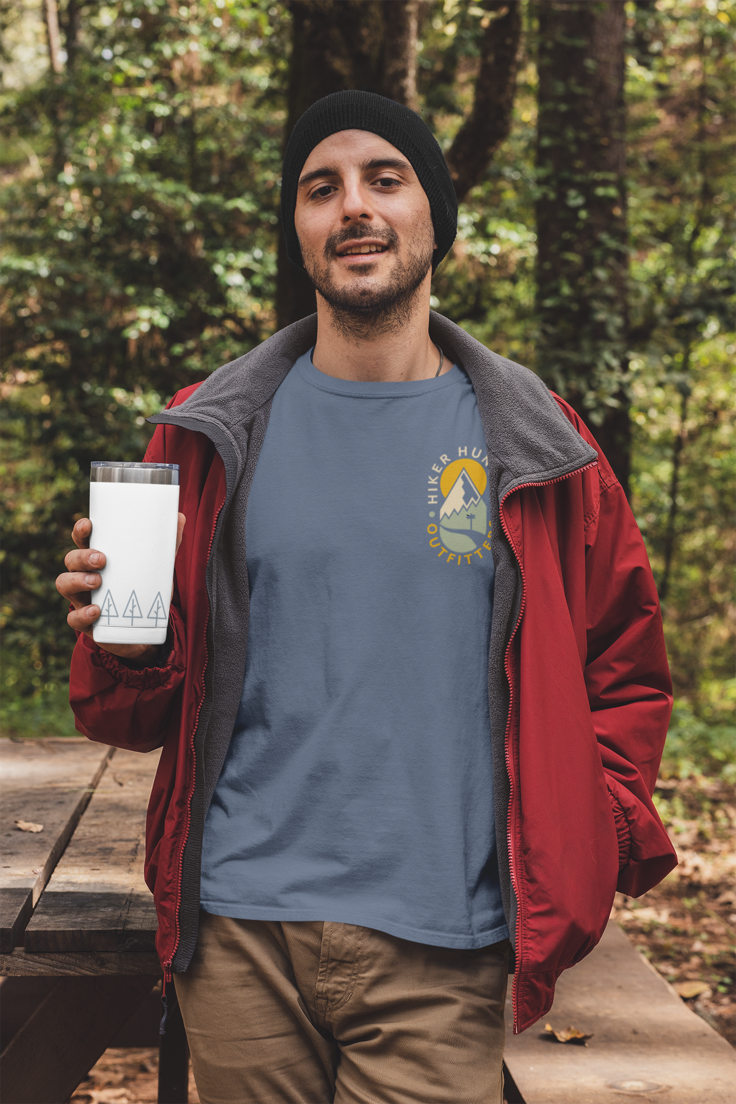 https://www.hikerhunger.com/cdn/shop/products/t-shirt-mockup-featuring-a-man-holding-a-20-oz-travel-mug-in-the-woods-30486_2_1440x.png?v=1614191136